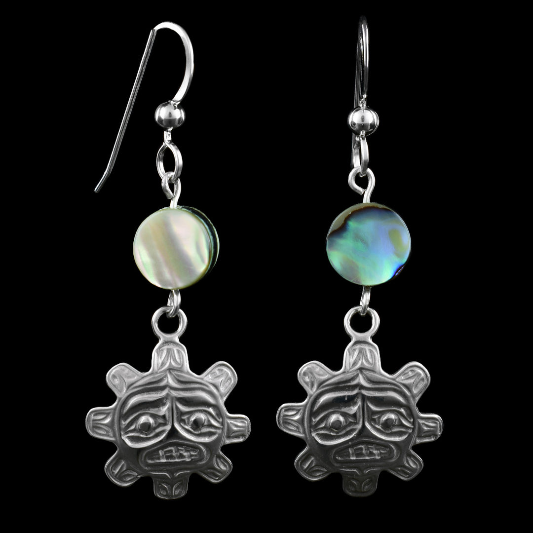 These silver sun dainty dangle earrings feature the sun engraved in round sterling silver with eight rays around the center. On top of the earring is a circular abalone shell bead, with many beautiful colour's blues, greens, and purples, finished with classic French hooks.