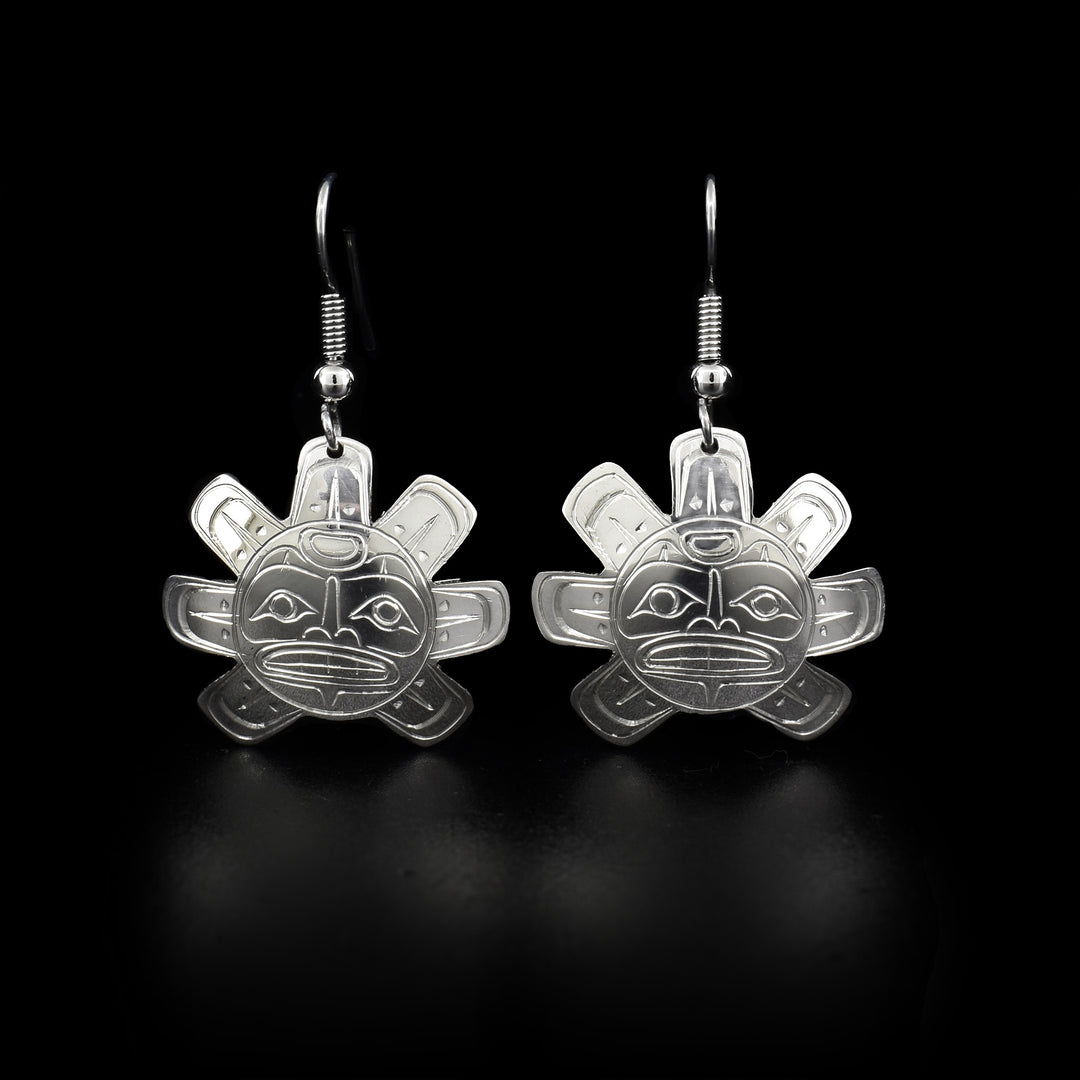 These sun earrings are circular in shape with 7 rays pointing out all directions except directly down. The face of the Sun has been carved in the center.