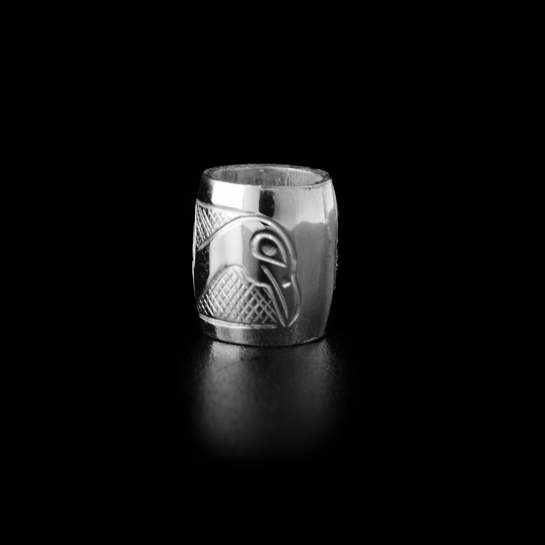 This Swan charm bead is made from sterling silver and is longer than it is wide. There is a depiction of the Swan carved into the surface of the bead.