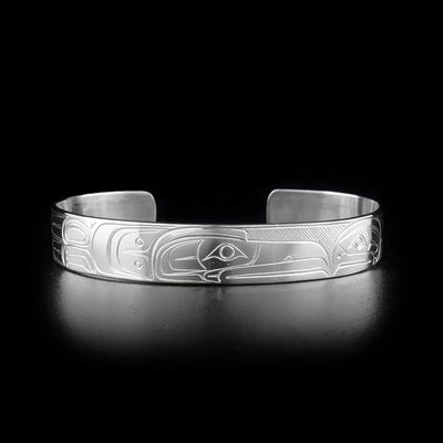 Sterling silver eagle and raven cuff bracelet. 0.38 inches wide. Meticulously hand-carved by Coast Salish artist Travis Henry.