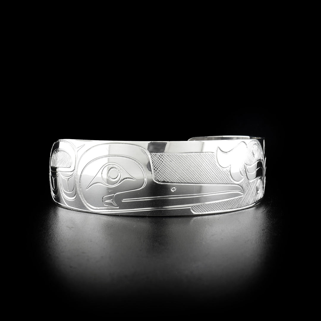 Sterling silver hummingbird cuff bracelet. 0.75 inches wide. Meticulously hand-carved by Coast Salish artist Travis Henry.
