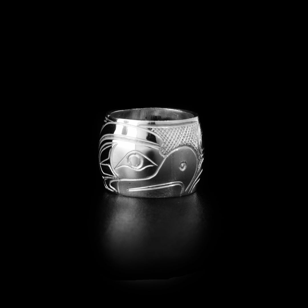These Thunderbird spirit beads are made from sterling silver and there is a depiction of the Thunderbird carved into the surface of it.