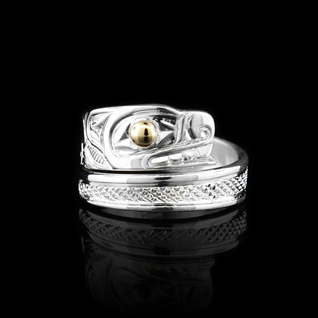 Sterling silver wrap ring with 14K gold bear eye. Band is a wrap that starts with the bears head.