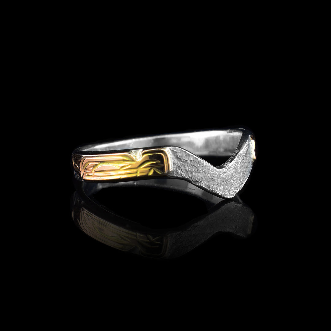 This Silver and Gold Wolf V-Ring has been hand caved with the legend of the wolf carved in 14k gold on the side of the ring. the top is formed into an elegant V  making a unique style.
