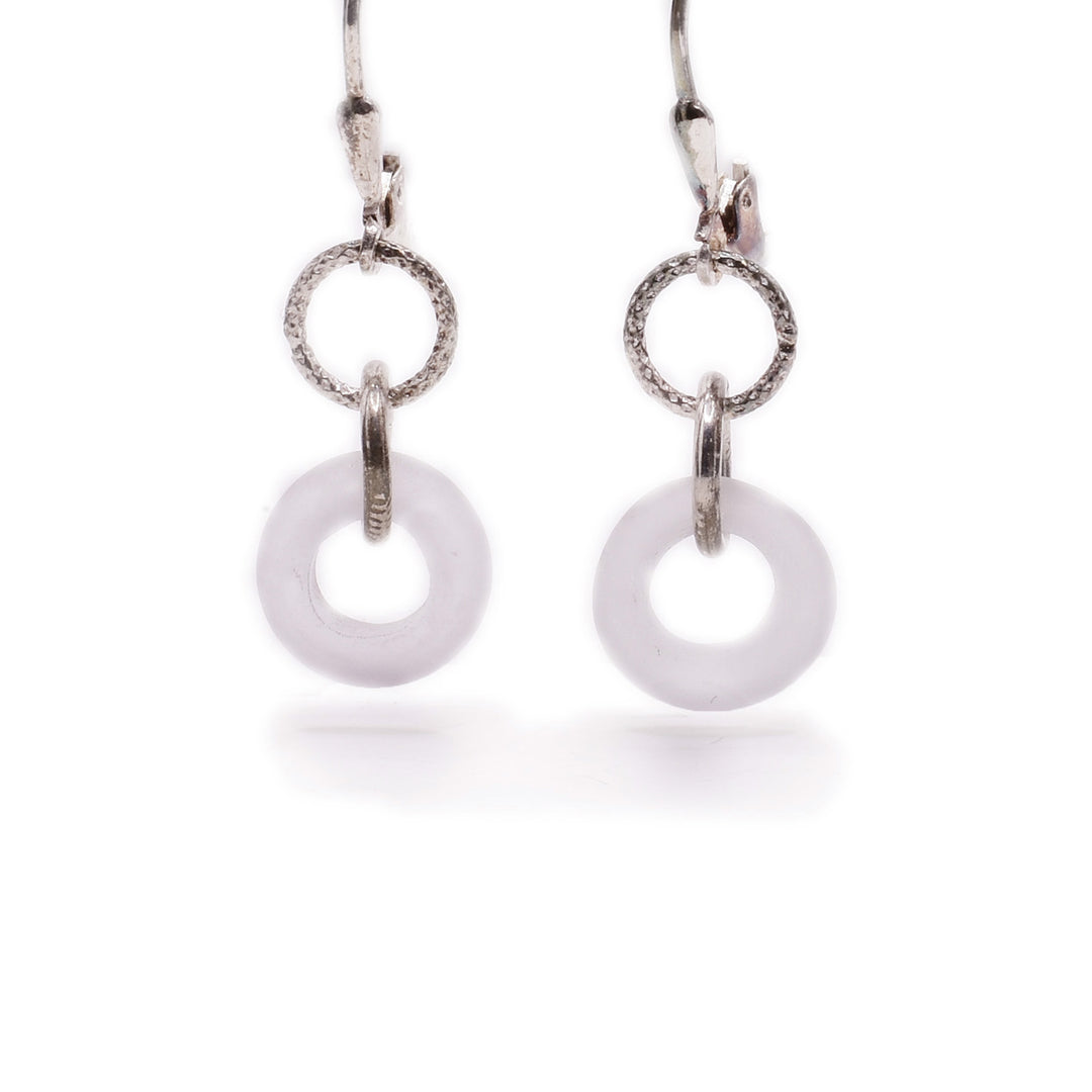 Sterling silver earrings with white, translucent handmade lampworked glass hoops. By Wendy Pierson.