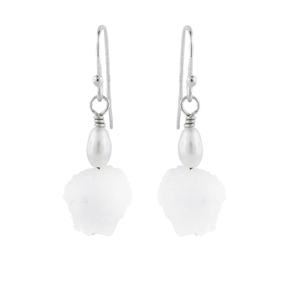 Sterling silver drop earrings featuring natural solar quartz crystals with a soft white finish and simple hook ear wires.