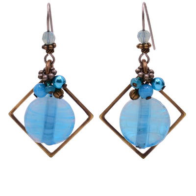 Dangle earrings made of swarovski crystal, handworked brass, lampworked glass, agate, and glass. Titanium hooks. By Honica.