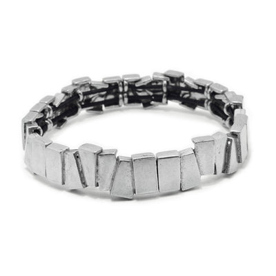 This pewter cuff bracelet is made from a combination of uniquely shaped rectangle pieces that connect around the entire piece. The pewter pieces don't line up neatly and give the bangle band a rough appearance. 