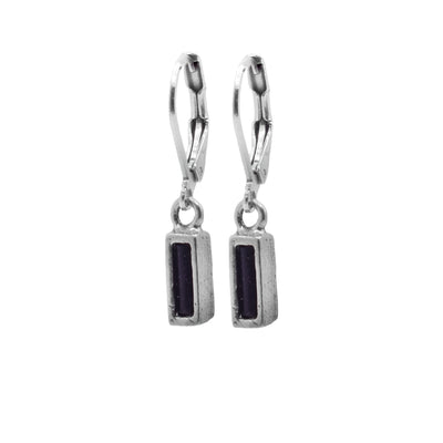 These dangling pewter earrings have thin, rectangle hangs made from pewter that hang from stainless steel hooks. The pewter hangs are filled with melted, black glass.