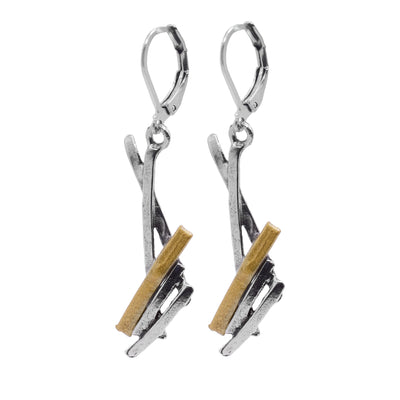 These abstract earrings have hangs that drop down and have a jagged cluster at the bottom of them. The hangs are made from long, thin pewter rectangles that are connected at various angles and there are gold plated highlights on them.