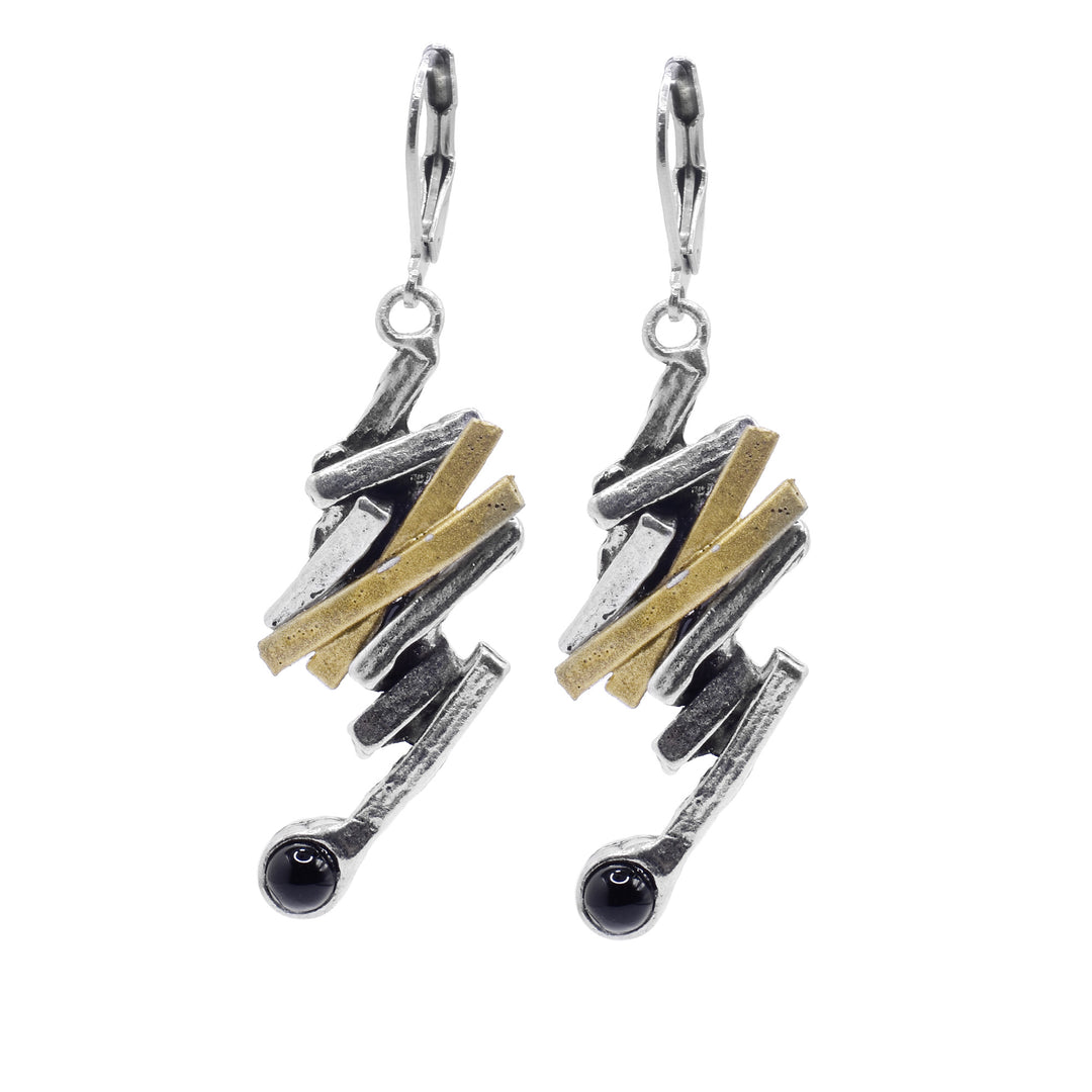 These black onyx and gold earrings are made from thin, pewter rectangles that connect to each other at different angles and drop down. There are two band of gold plated material on each piece and at the bottom of the hangs are round, black onyx gemstones.
