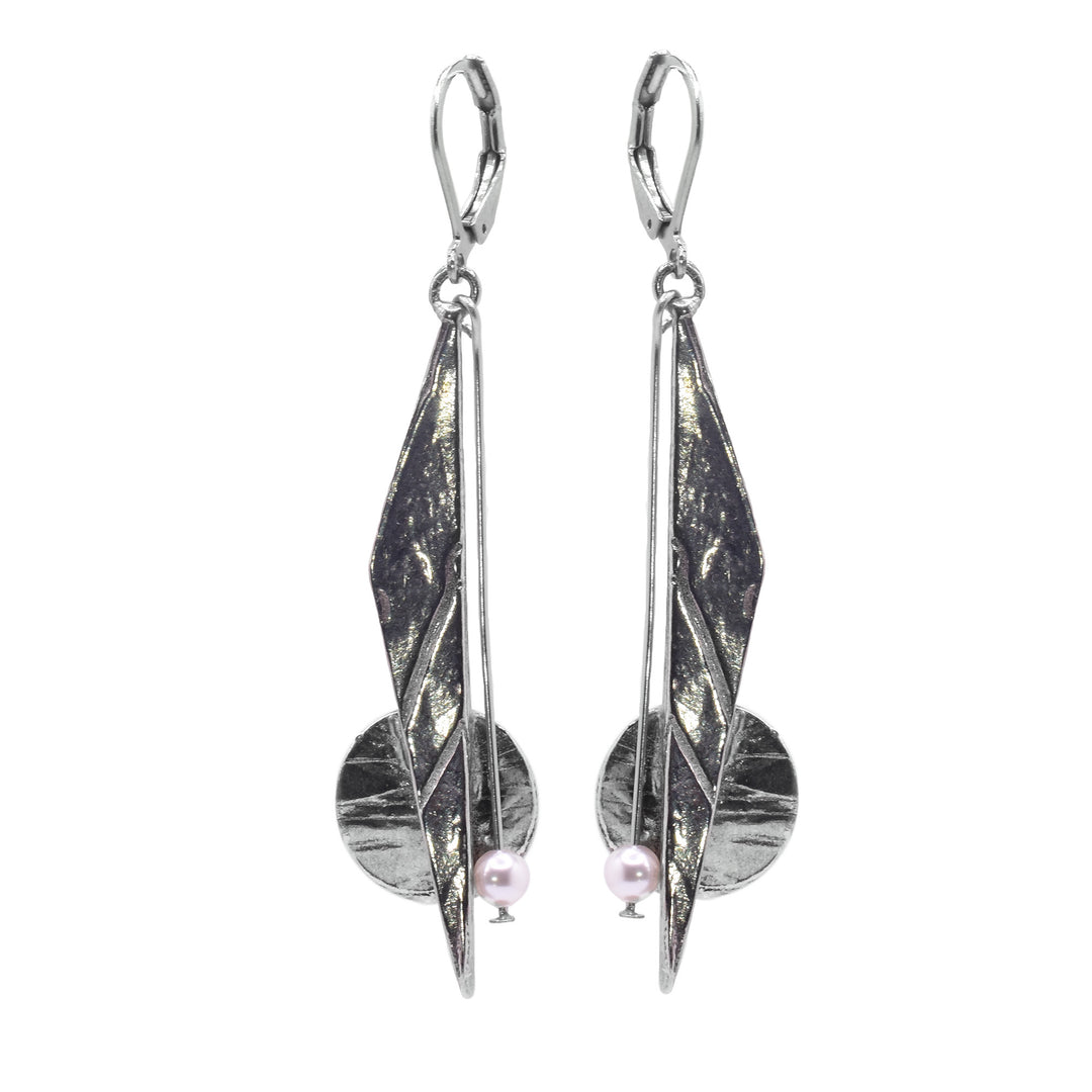 These dangle drop earrings have three seperate hangs, on that is long, triangular and made of pewter. The next is a circle shaped hang made from pewter that drops down from a chain. The last is a small, Swarovski pearl that is dangling form a chain.
