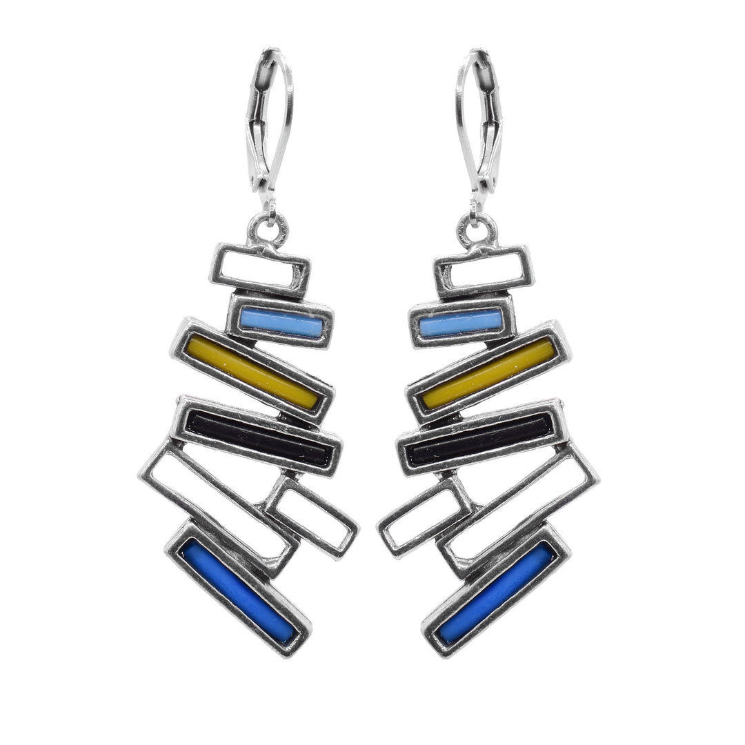 These pewter, abstract earrings have large hangs that are made up of several thin, cutout and pewter rectangles that are stacked horizontally at different angles. Three of the rectangles on each hang are filled with black, yellow, blue and turquoise molten glass.
