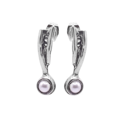 These pewter drop earrings are studs that have pewter triangles that drop down. These pieces are textured and have round, Swarovski pearls held at the bottom of the earrings.