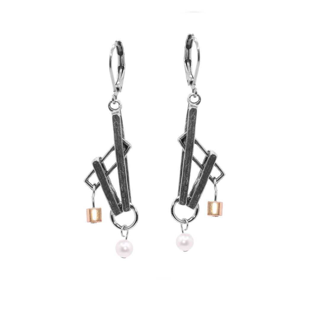 These dangling pearl earrings are made from thin, rectangle pewter pieces that drop down and are connected at different, acute angles. There are pearls dangling at the bottom and a gold plated cube dangling above the pearls at an angle.