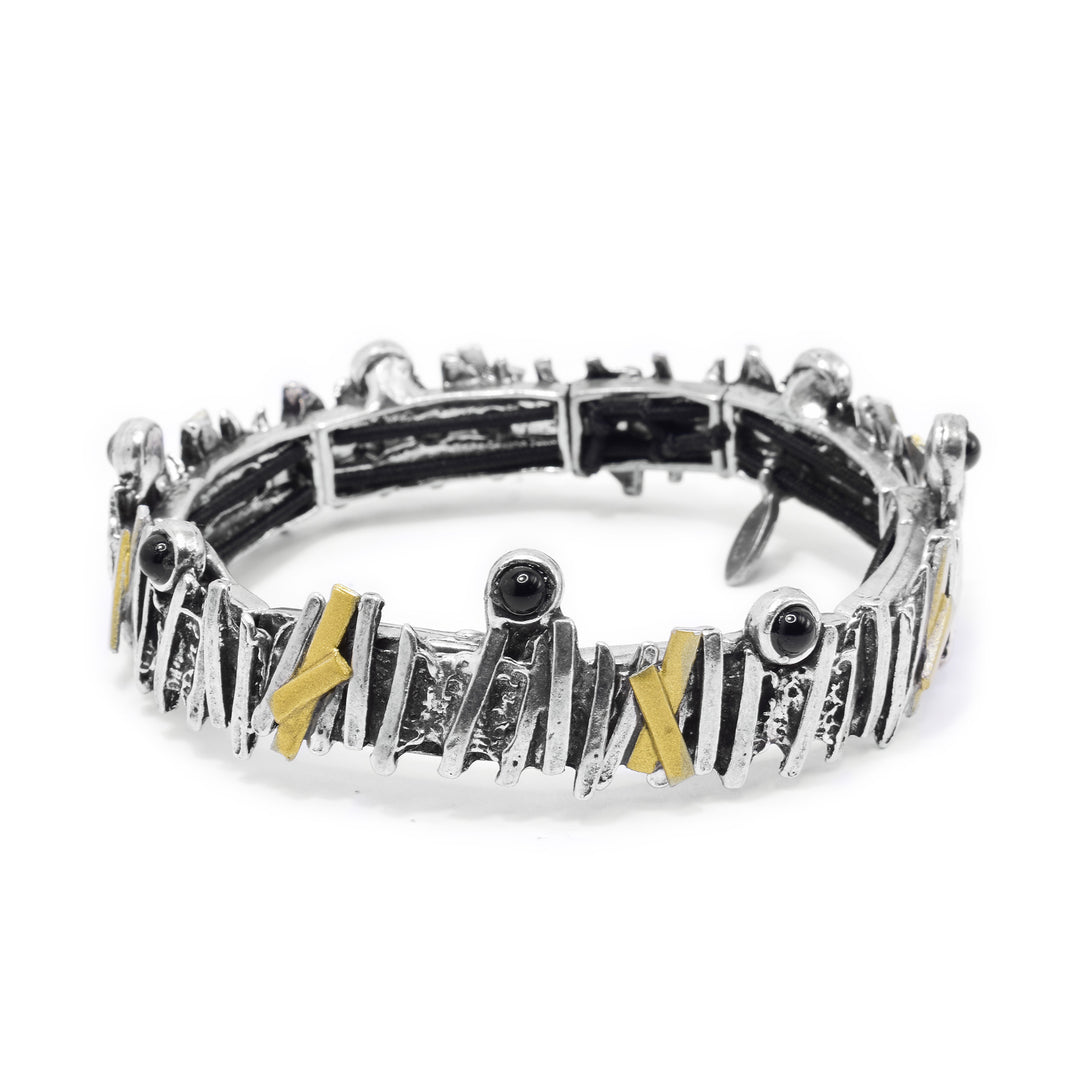 This black onyx bracelet has a single band made from pewter. There are thin, vertical strips made from gold plating and pewter. The strips go around the entire piece and give that band a jagged look. There are several black onyx gems held around the bangle bracelet.