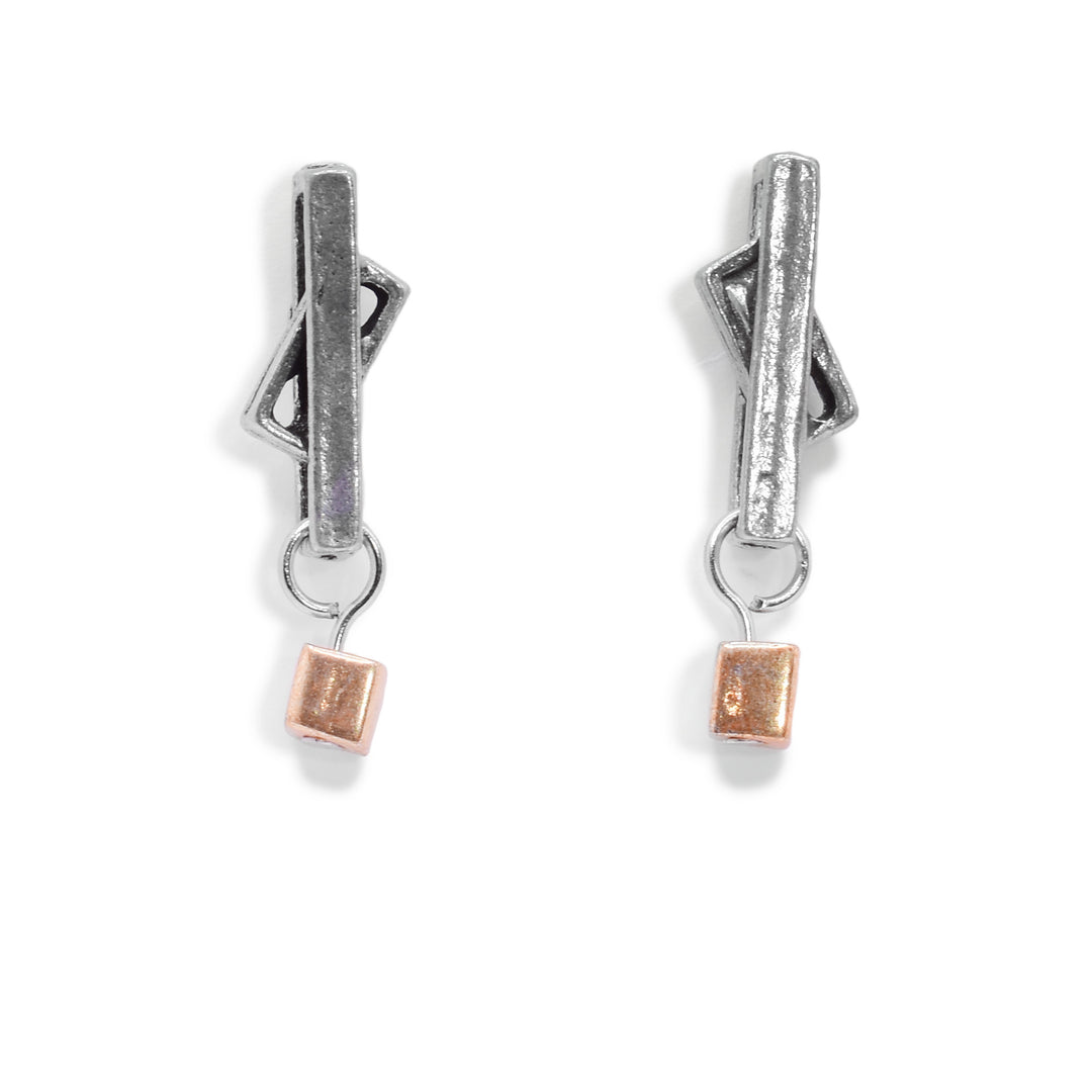 These drop stud earrings consist of a cutout rectangle with a small rectangle held between the larger rectangle. The rectangles are made from pewter and at the bottom of these stud earrings are gold plated cubes.