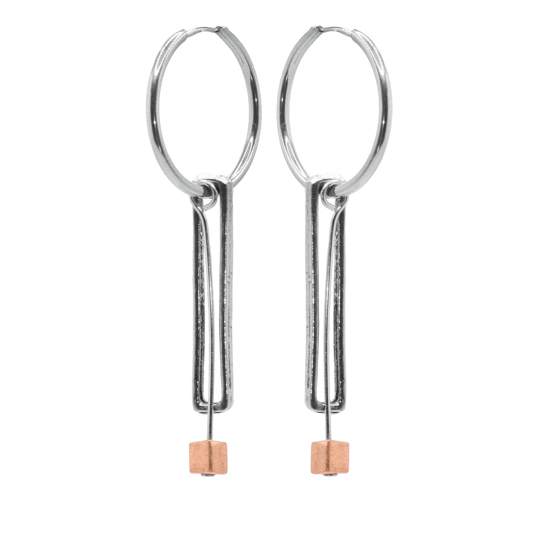 These pewter drop earrings consist of long, thin and rectangular hangs dropping down with small, gold filled cubes danling from the bottom of them. The hangs dangle from stainless steel hoop-hooks and are made from pewter.
