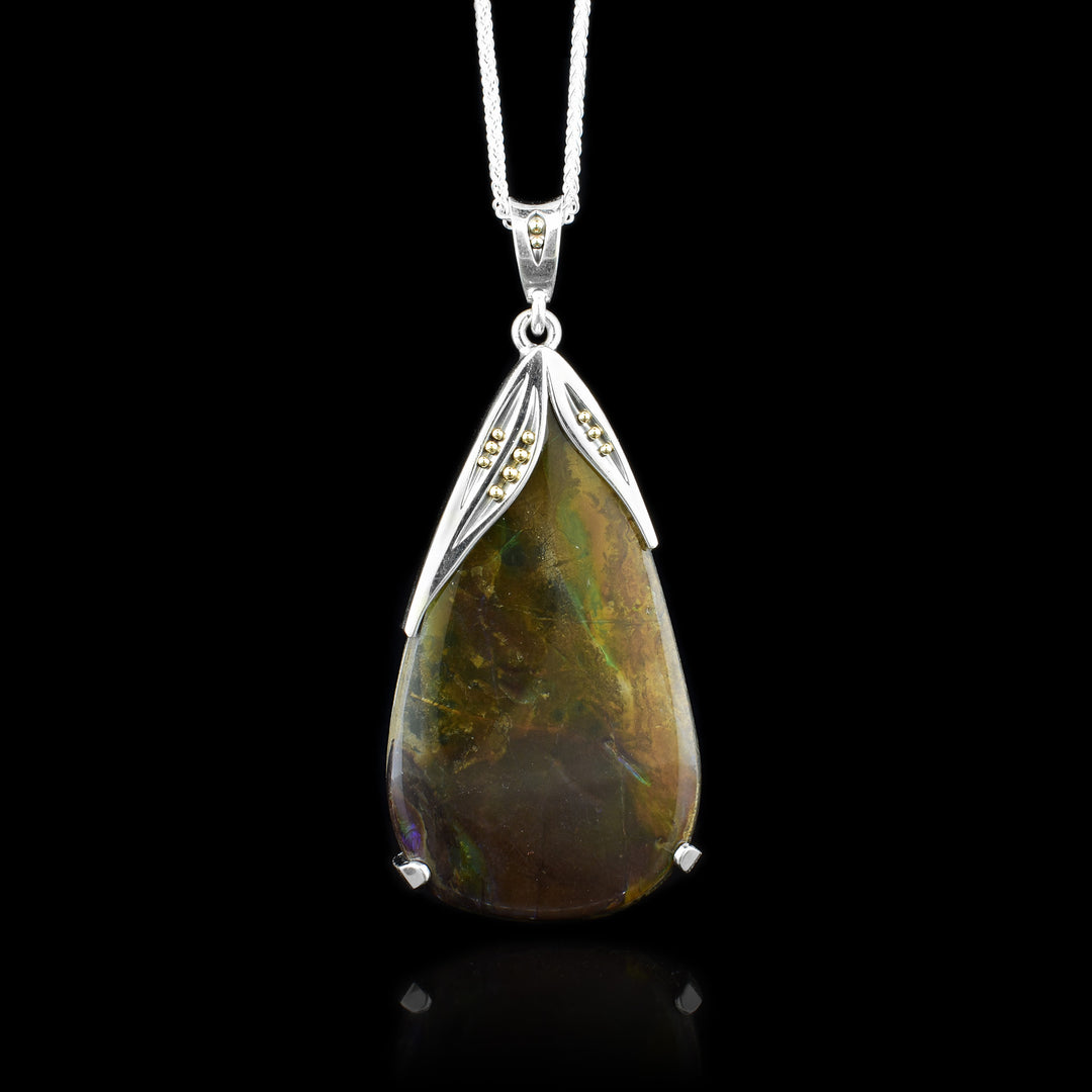 Sterling Silver 10K Gold Ammolite Pendant, with two types of metal the ammolite pendant is perfectly contrasted with the mixed metal frame.