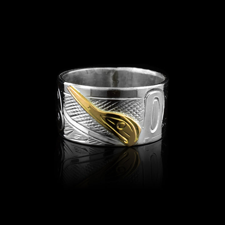 Graham Henry band made of sterling silver and 10k gold. Featuring the Hummingbird legend hand-carved in gold against a silver band.