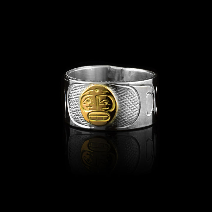 this sterling silver and 10k gold band by artist Graham Henry. Featuring the Moon legend hand-carved in solid 10k gold against a detailed silver band, this mixed-metal piece showcases master craftsmanship and traditional design.