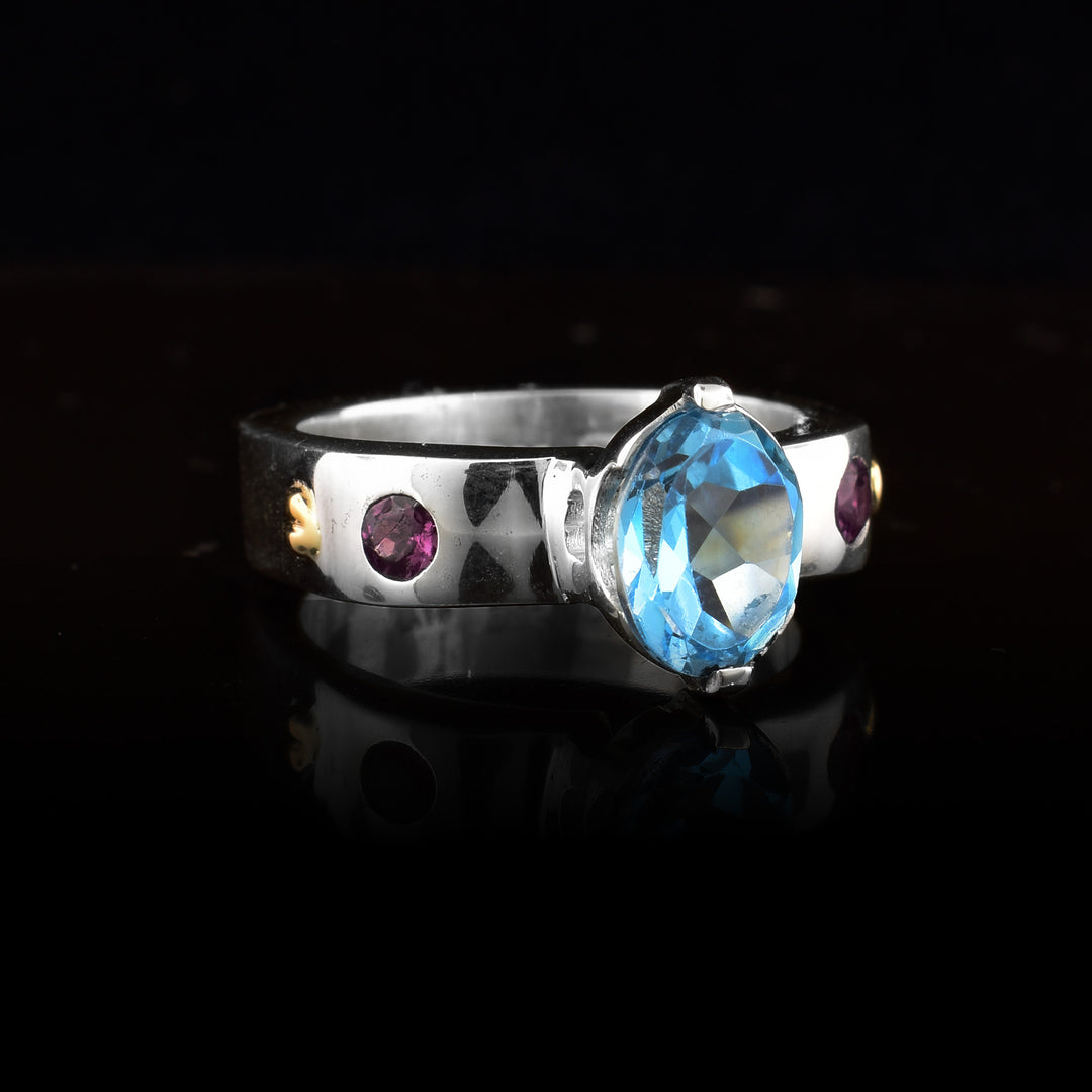 Sterling Silver 14k Gold Blue Topaz with Red Garnet Accent Ring