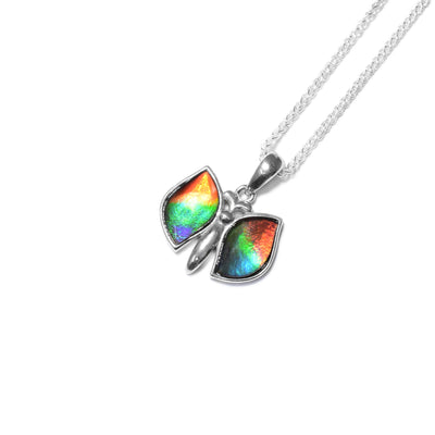 Flying sterling silver butterfly. Wings are open and filled with AA-grade ammolite.