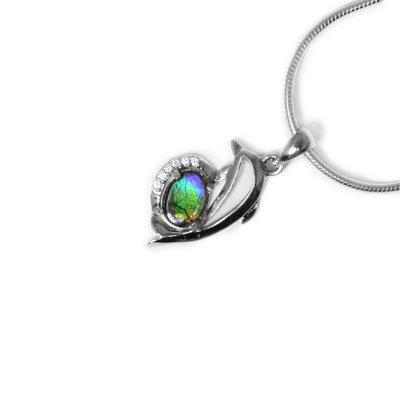 Sterling silver dolphin frame, on its underside is an oval piece of ammolite. Ammolite has six cubic zirconia bordering the side not connected to the dolphin. Ammolite changes colour depending on how you look at it.