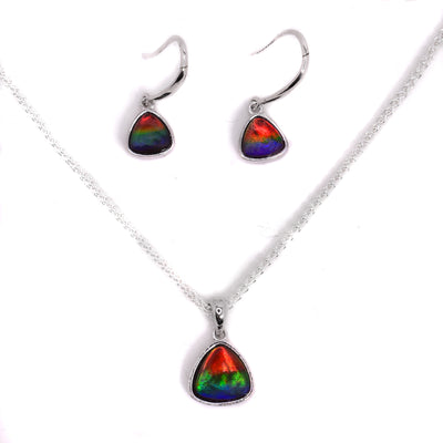 This dangle earrings and pendant set features polished, rounded, triangular ammolite set in sterling silver. By Enchanted Designs.