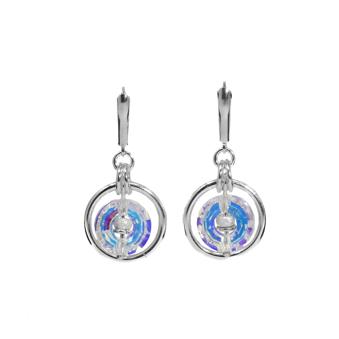 Dangle earrings with flange hooks. Circular aurora borealis Swarovski crystals in sterling silver rings. Silver adornments in center of crystal rings.