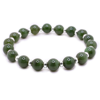 BC jade beaded bracelet with 0.3” jade beads and smaller sterling silver cylindrical beads between.