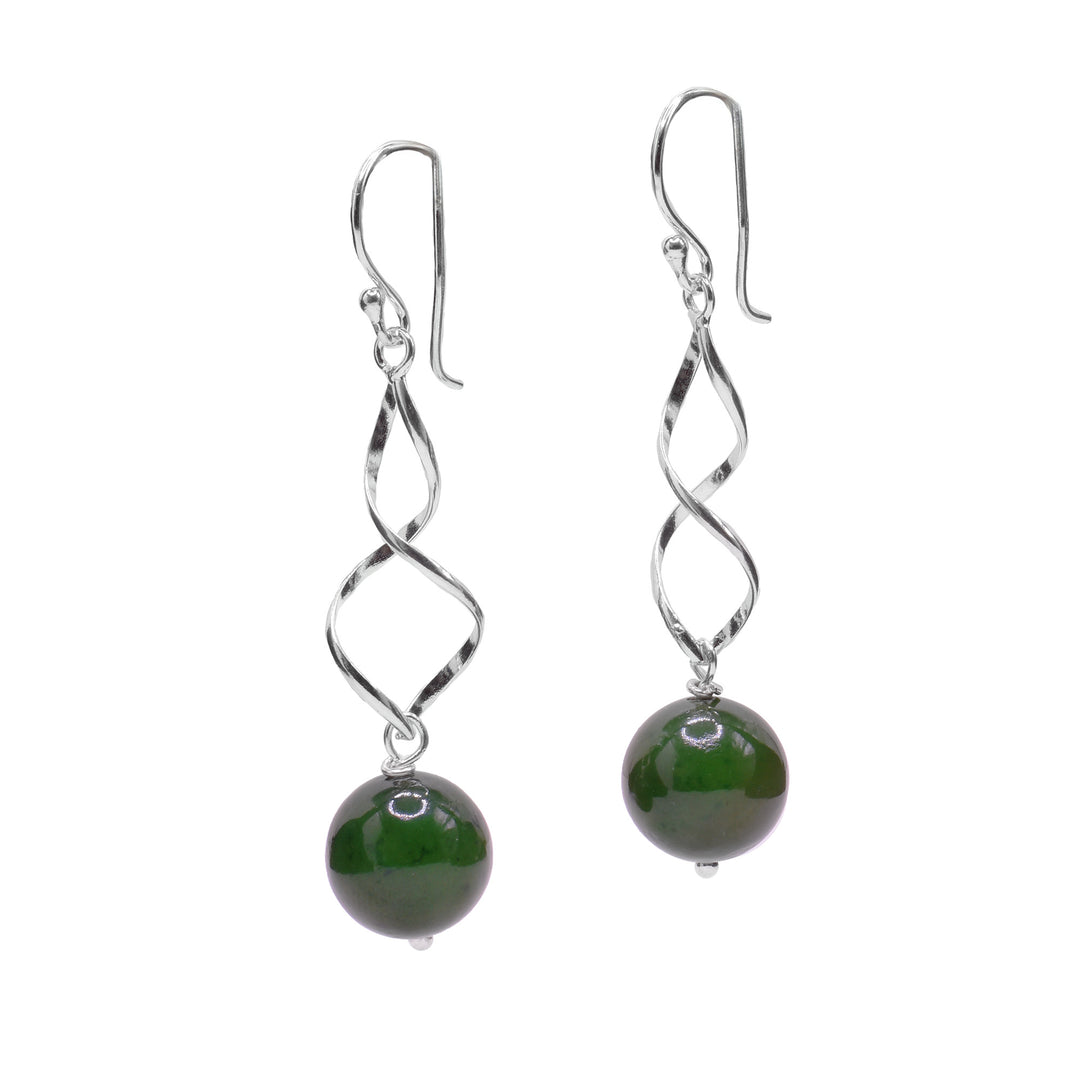 For each earring, sterling silver twists down to a round BC jade bead. Minimalist design. Lever back hooks.