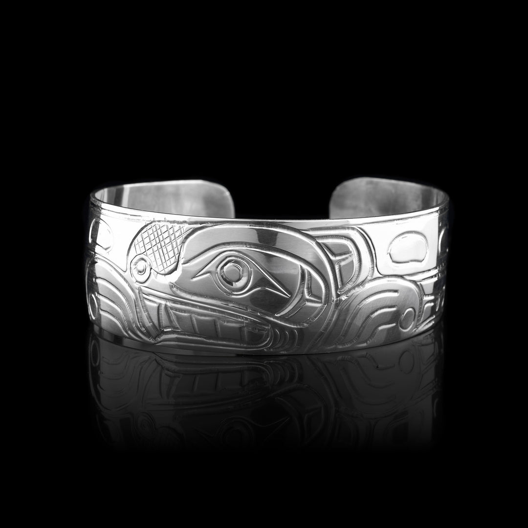This Bear cuff bracelet is made with sterling silver. The legend of the bear has been carefully carved into the surface of the bracelet.