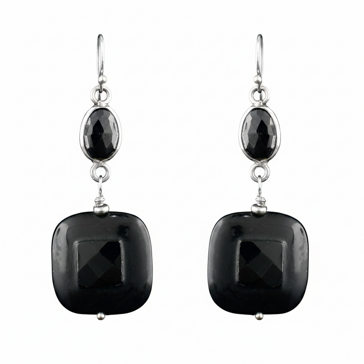 Discover the perfect blend of bold and classic. These handcrafted black onyx and sterling silver earrings feature a striking geometric silhouette.