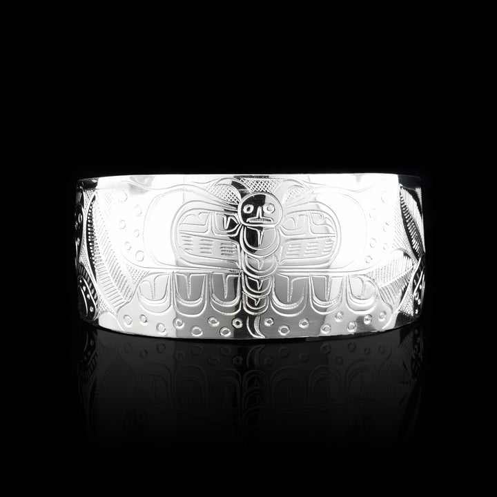 Sterling Silver Butterfly Cuff. The carving of the butterfly legend is in the middle of the cuff surrounded by flowers.
