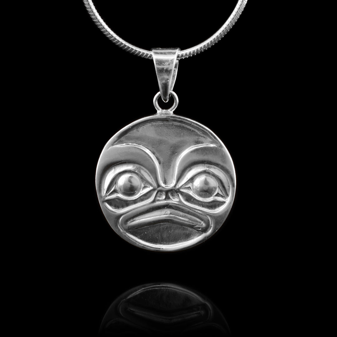 This Sterling Silver Circular Frog Pendant has a hand carved face of the frog in the circular pendant. 