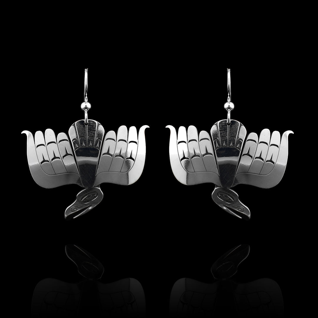 Sterling Silver Crow Diving Earrings, this full body crow has been carved with detail in feathering and its face.
