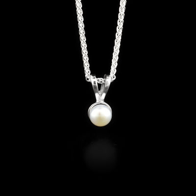 Sterling silver dainty white freshwater pearl pendant by Ivan Dobren.