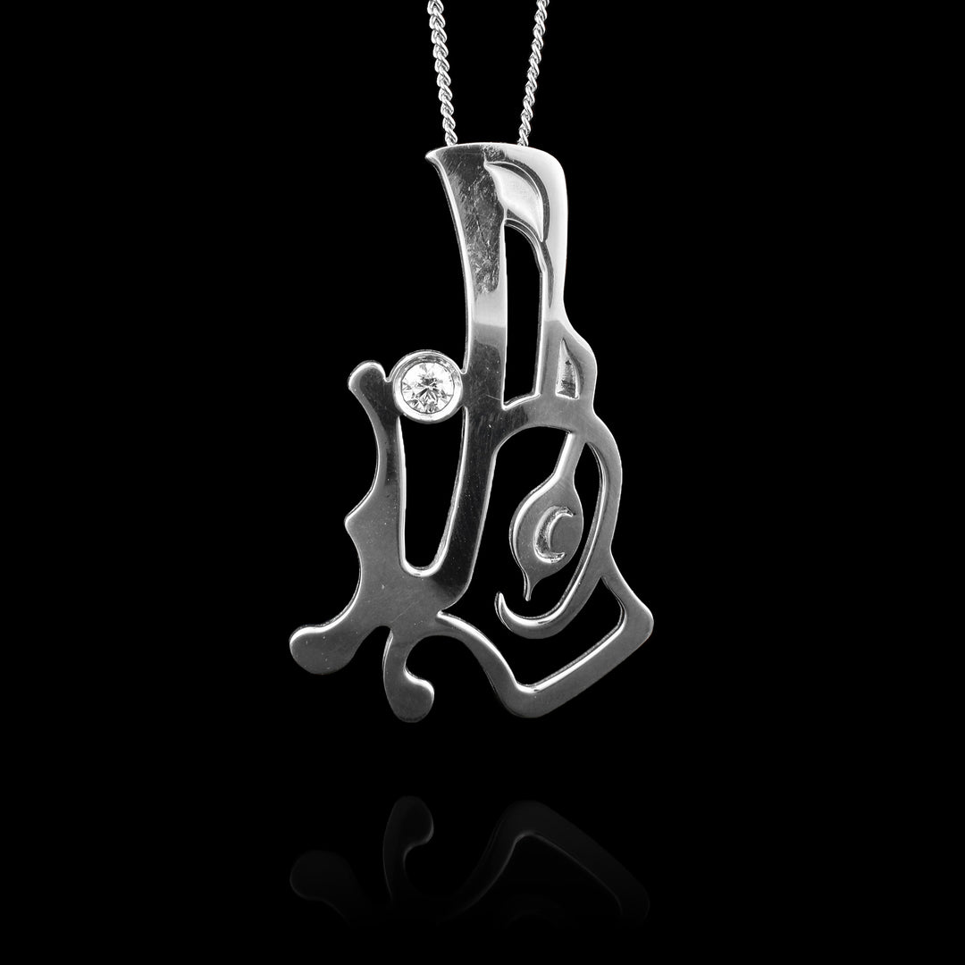 Shop this large sterling silver Raven pendant by Haida Gwaii artist Gina Mae Schubert. Handcrafted with a detailed Raven design, this statement piece features a genuine diamond accent set in the Raven's mouth.