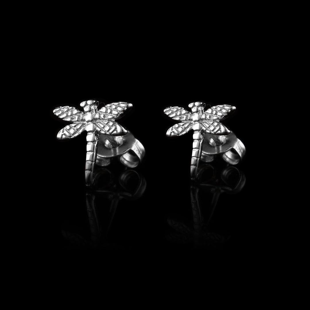 dainty sterling silver dragonfly stud earrings. carved with detail in the wings and body. 