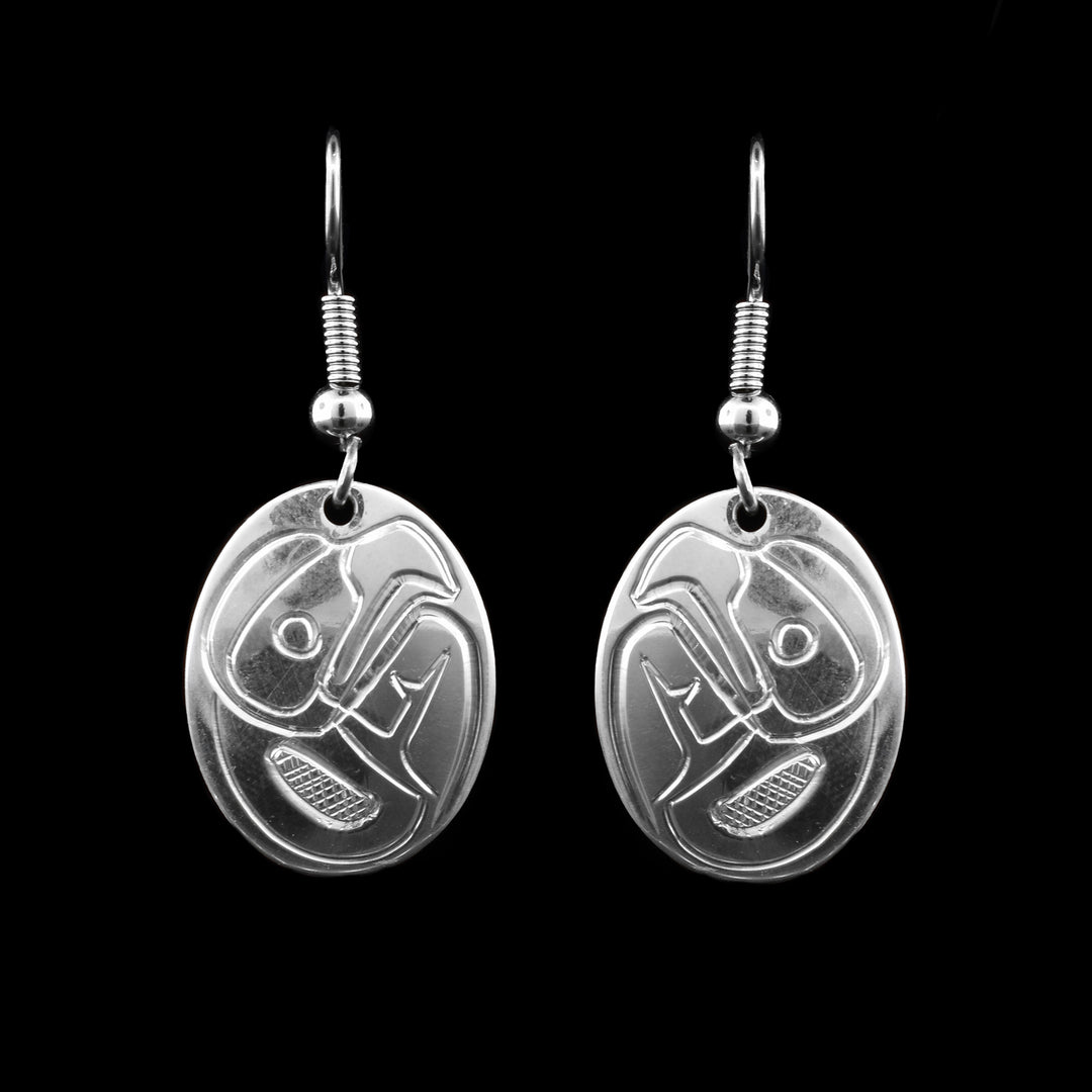 These sterling silver dangling earrings are beautifully hand carved with the eagle legend. 