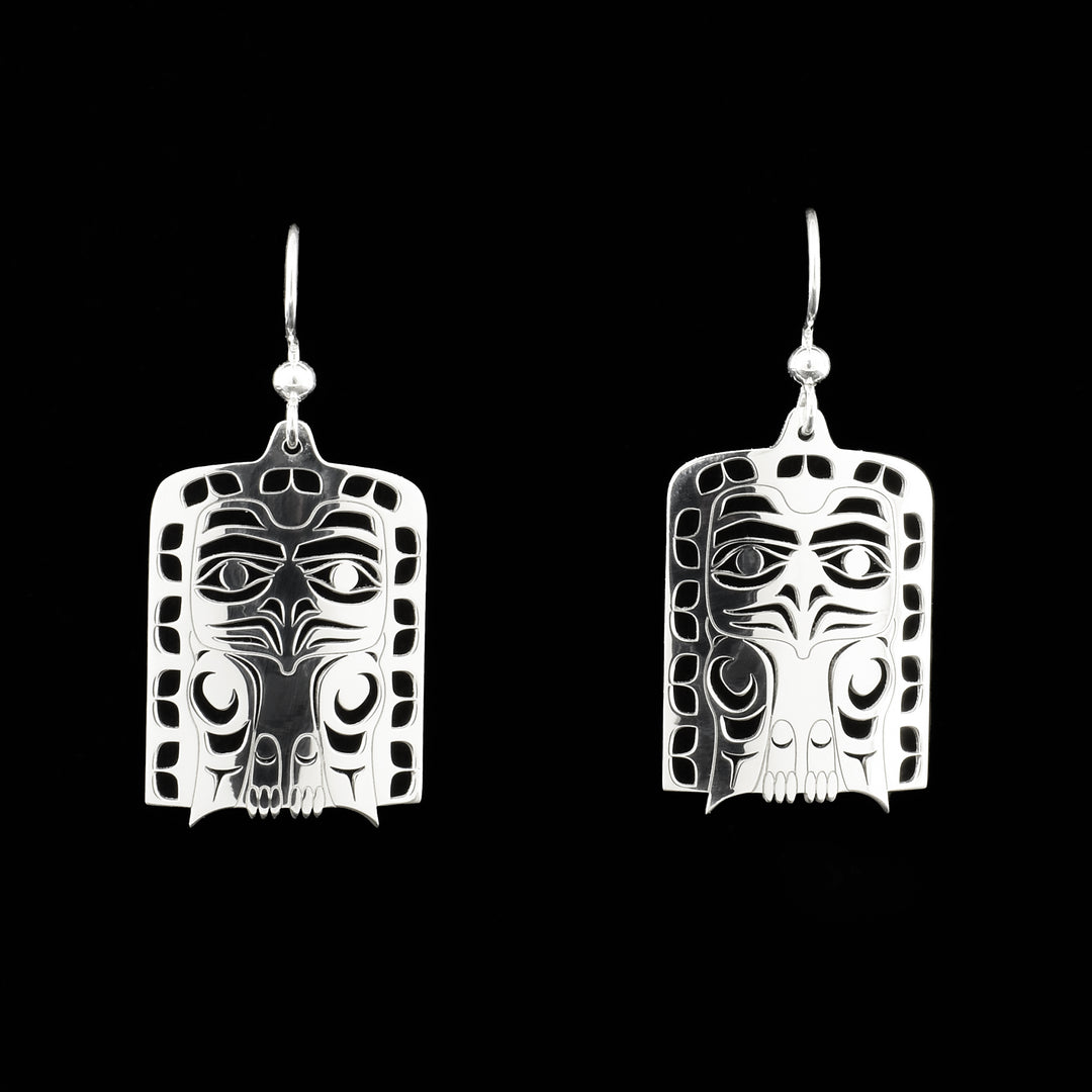 Eagle frontlet dangle earrings. Frontlets have shapes cut out. By Tahltan artist Grant Pauls.