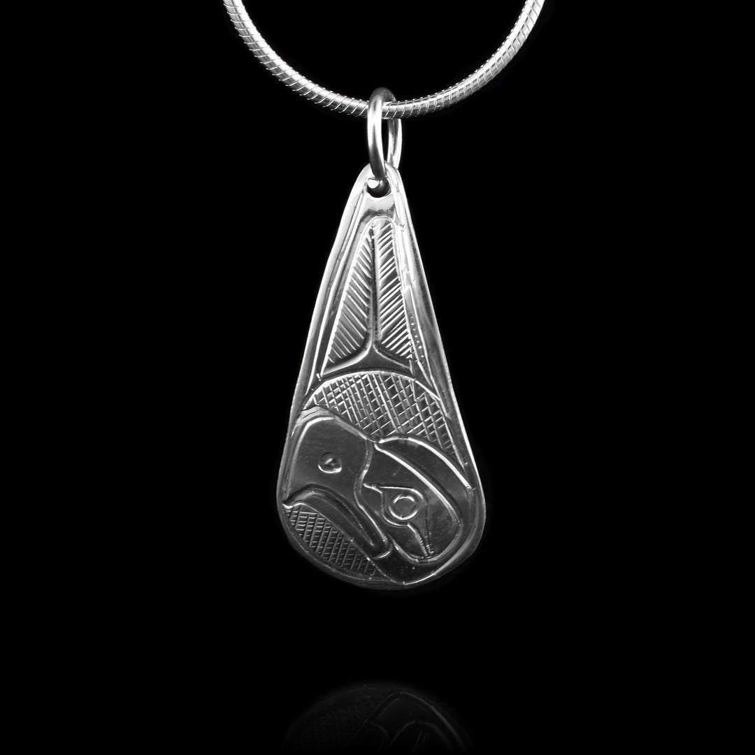 This Sterling Silver Eagle Teardrop Pendant has been hand-carved with the legend of the eagle. The eagle head sits at the bottom of the teardrop shape, looking up into the etching above.
