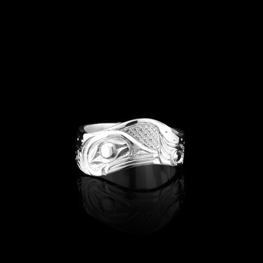 This Sterling silver wavy band ring has been hand carved with the symbol of the frog.