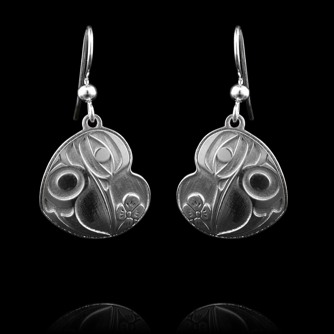 These sterling silver heart-shaped hummingbird dangle earrings are cast into sterling silver witht the legend of the hummingbird cast into them. 