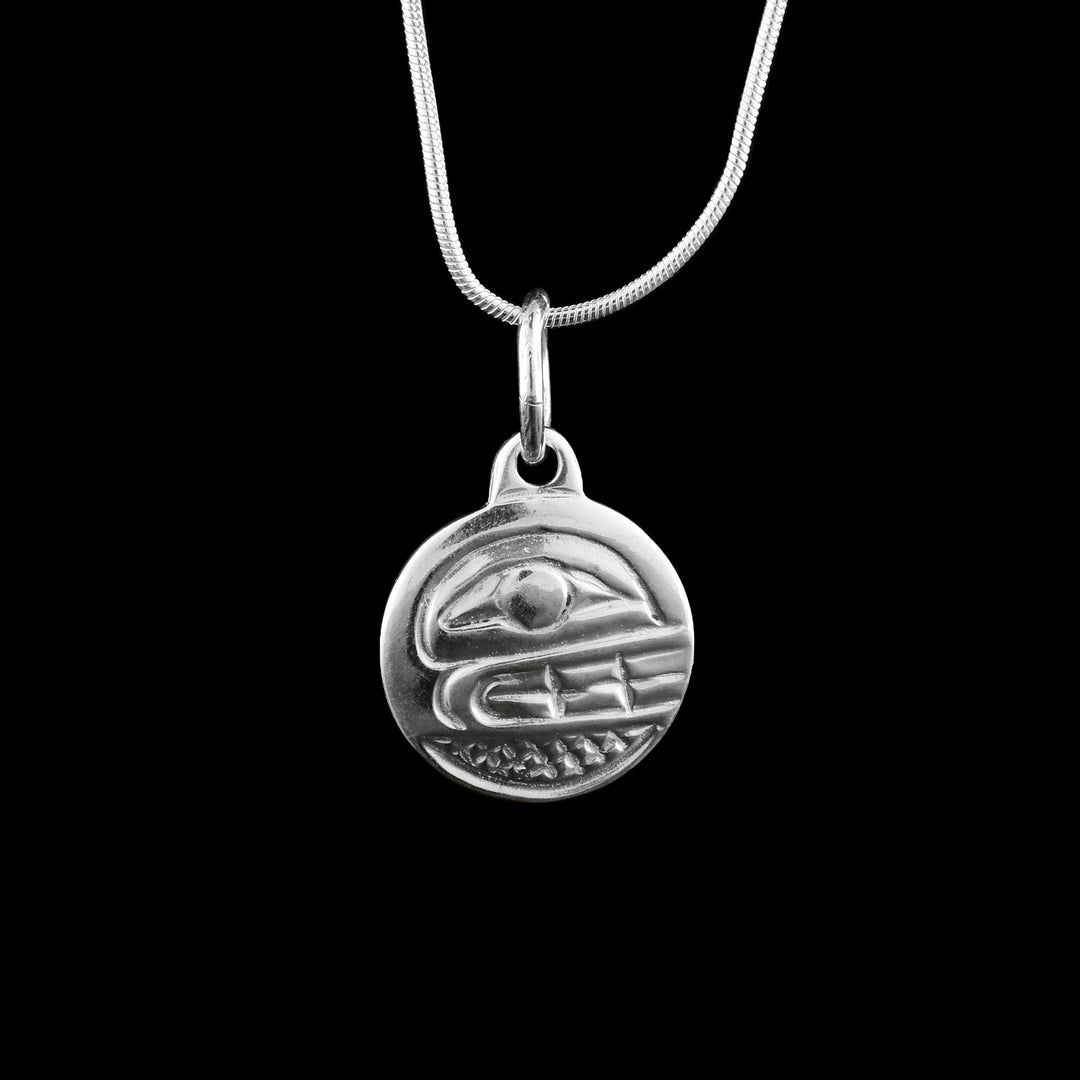 Sterling Silver Circle Pendant with the Orcas face casted on the surface of the pendant.