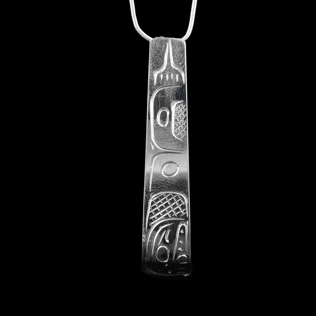 This sterling silver Orca tapered pendant carved with the indigenous legend of the Orca.
