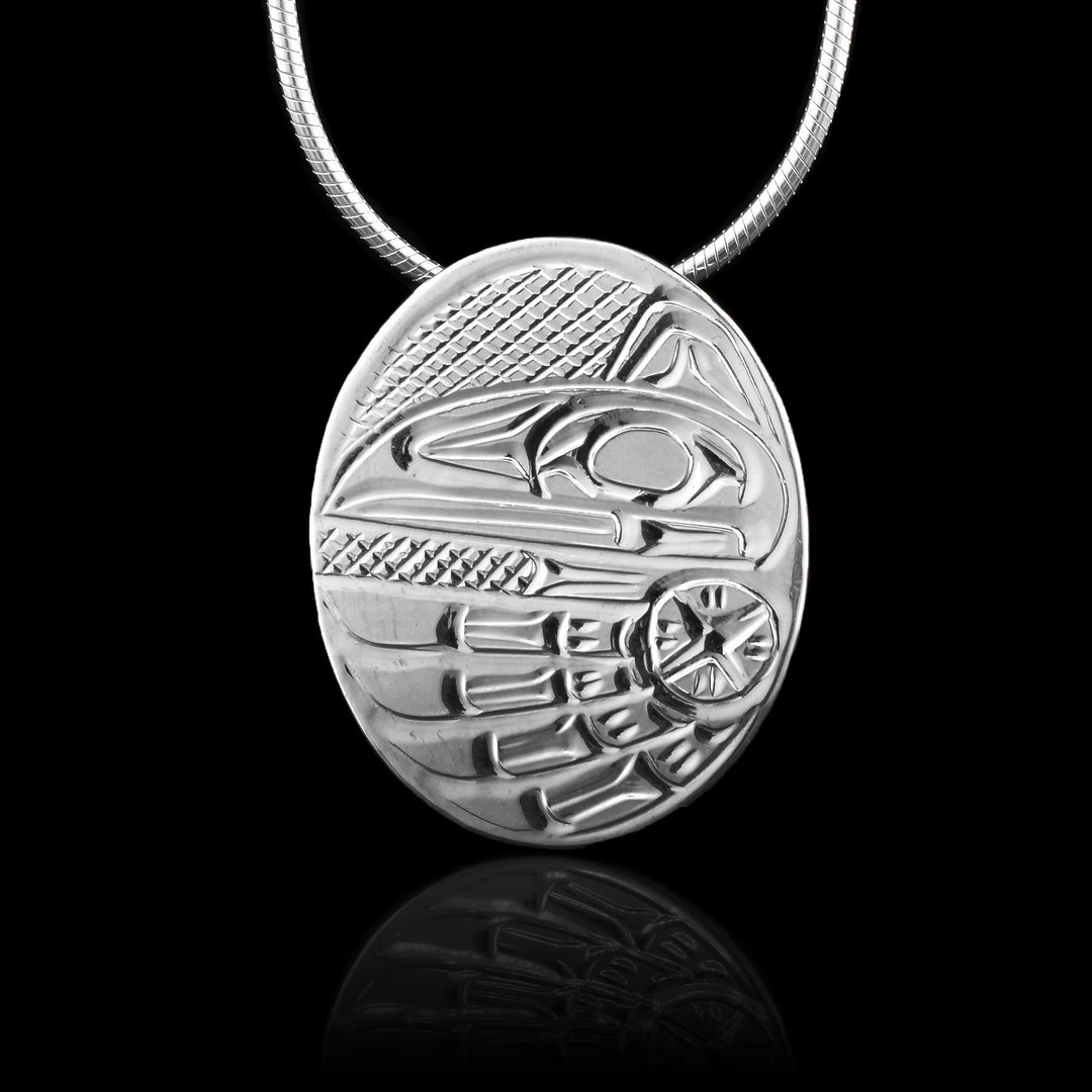 Indigenous carved Sterling Silver Oval Raven Pendant