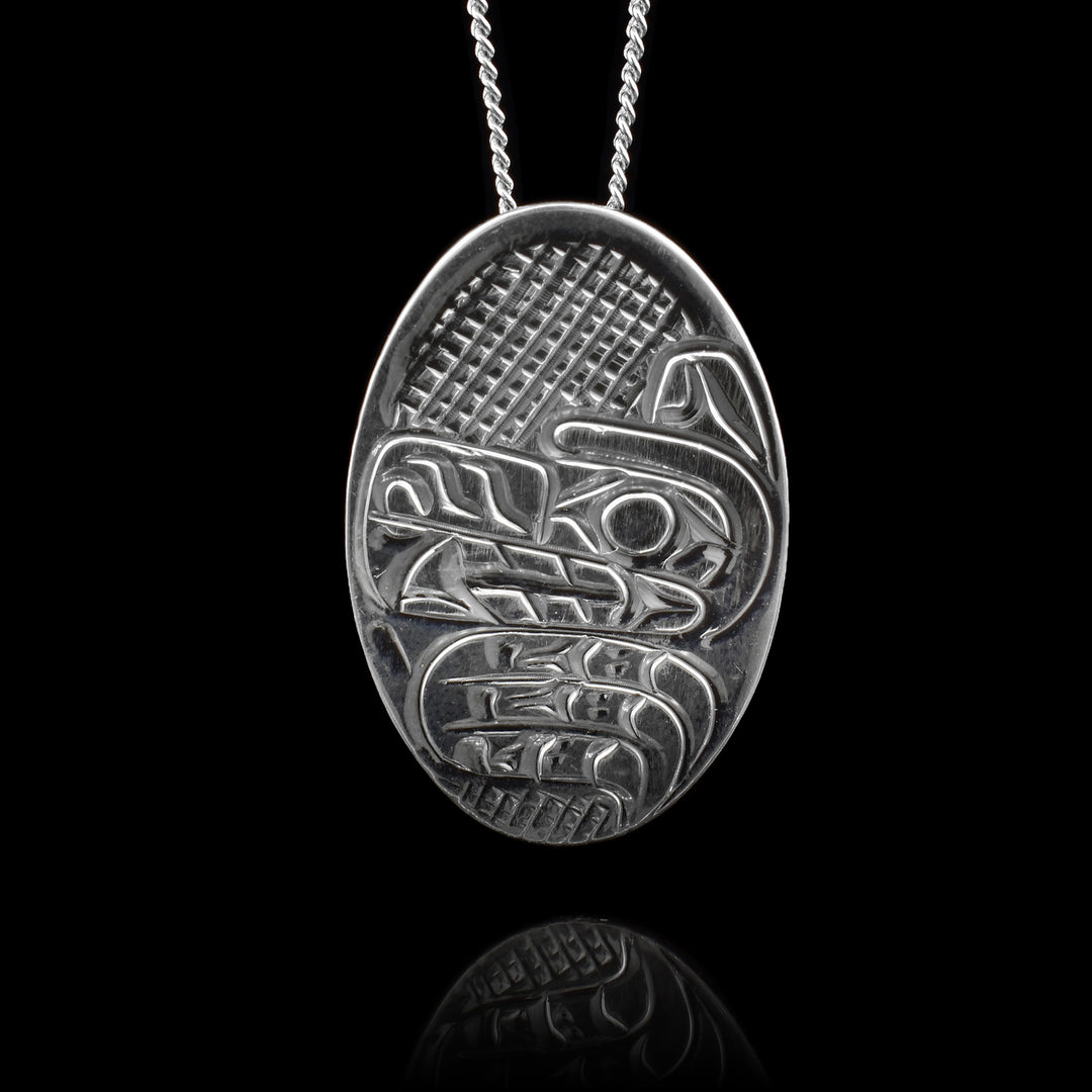 Indigenous carved Sterling Silver Oval Wolf Pendant