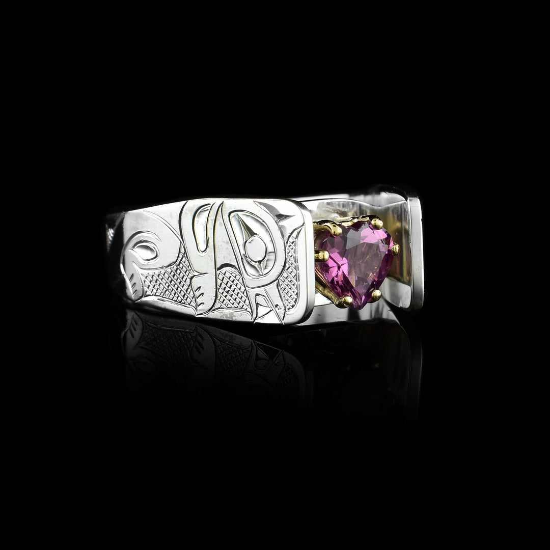 Sterling Silver band with the legend of the Otter carved into it. With Purple heart shaped garnet  Solitaire Ring the stone is held with 14k gold prongs.
